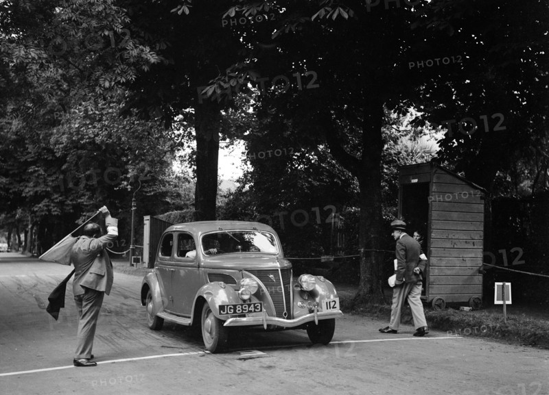 JB Thompson's Ford V8 on the way to winning bronze in the MCC Torquay Rally, July 1937. Artist: Bill Brunell.