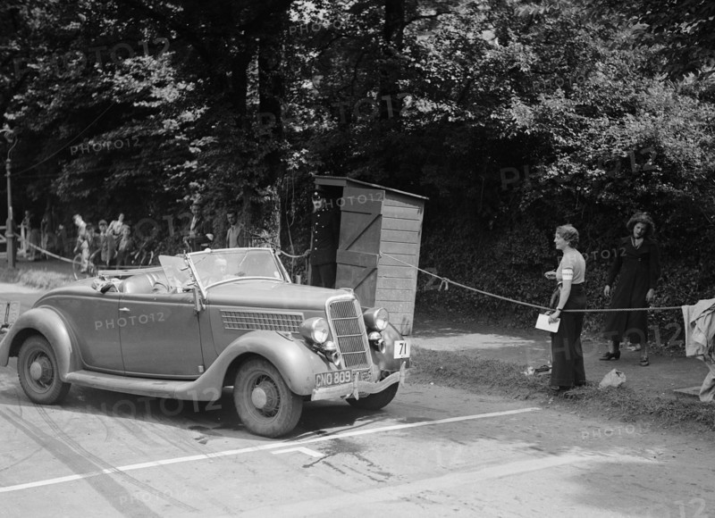 DJH Currie's Ford V8, winner of a silver award at the MCC Torquay Rally, July 1937. Artist: Bill Brunell.