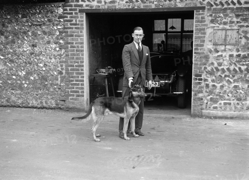 Geoffrey Baker and his alsatian. Artist: Bill Brunell.