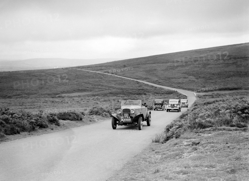 Ford V8s of WCN Norton and J Harrison competing at the MCC Torquay Rally, July 1937. Artist: Bill Brunell.