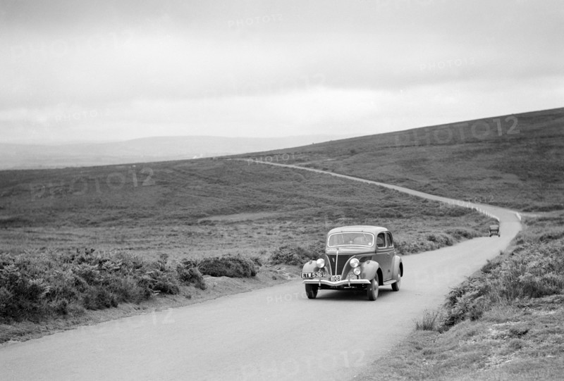 Ford V8 of J McEvoy, winner of a bronze award at the MCC Torquay Rally, July 1937. Artist: Bill Brunell.