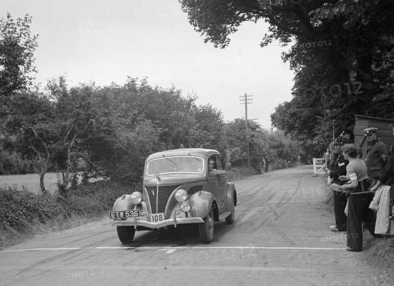 Ford V8 of J McEvoy, winner of a bronze award at the MCC Torquay Rally, July 1937. Artist: Bill Brunell.