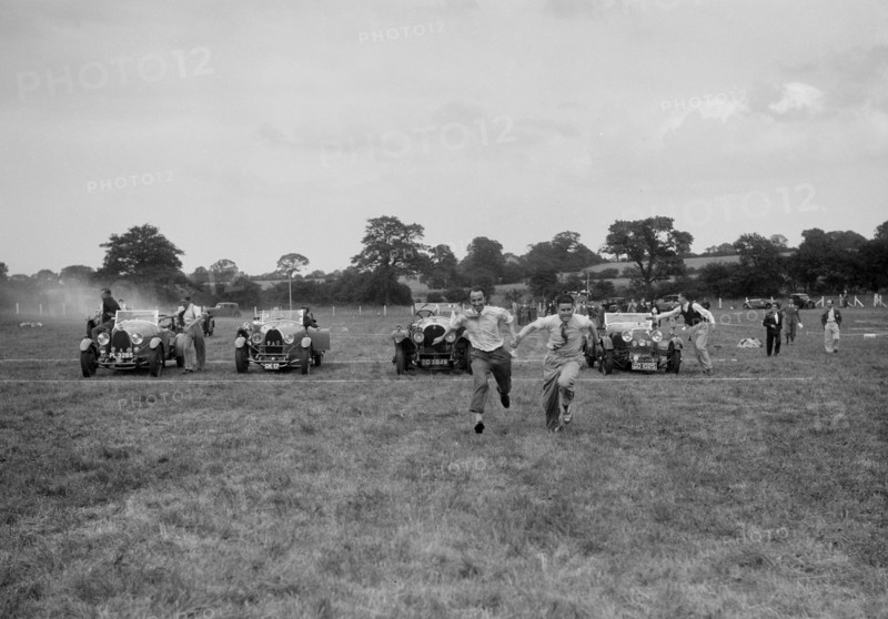 Bugatti Type 43 and 44 and a Bentley taking part in the Bugatti Owners Club gymkhana, 5 July 1931. Artist: Bill Brunell.