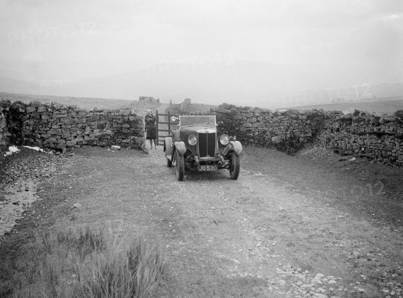 Kitty Brunell road testing a MG 18/80, April 1931. Artist: Bill Brunell.