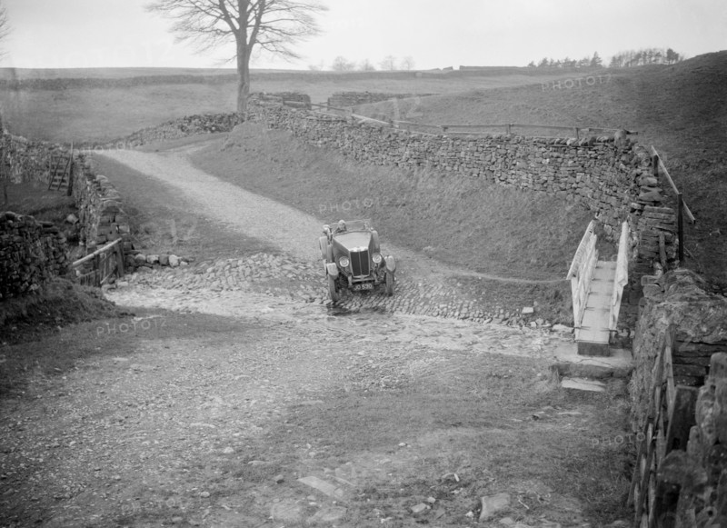 Kitty Brunell road testing a MG 18/80, Tan Hill, Yorkshire, April 1931. Artist: Bill Brunell.