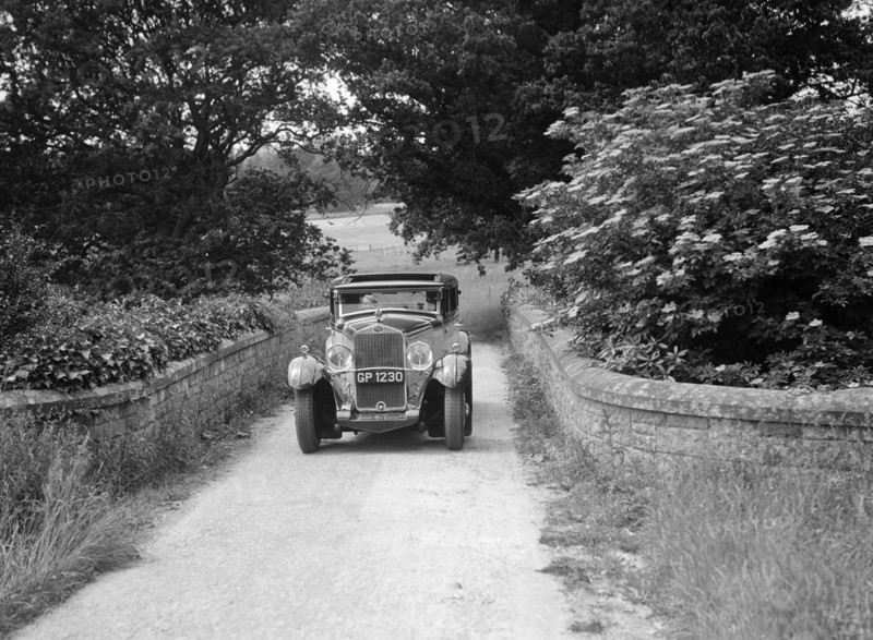 Kitty Brunell road testing a 1931 Delage D8. Artist: Bill Brunell.
