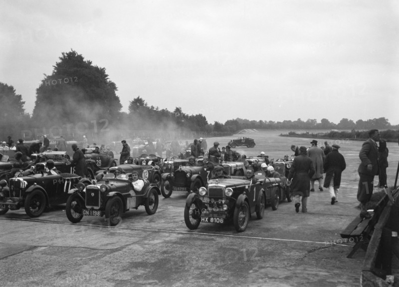 Cars on the starting grid for the Brighton & Hove Motor Club High Speed Trial, Brooklands, c1931. Artist: Bill Brunell.