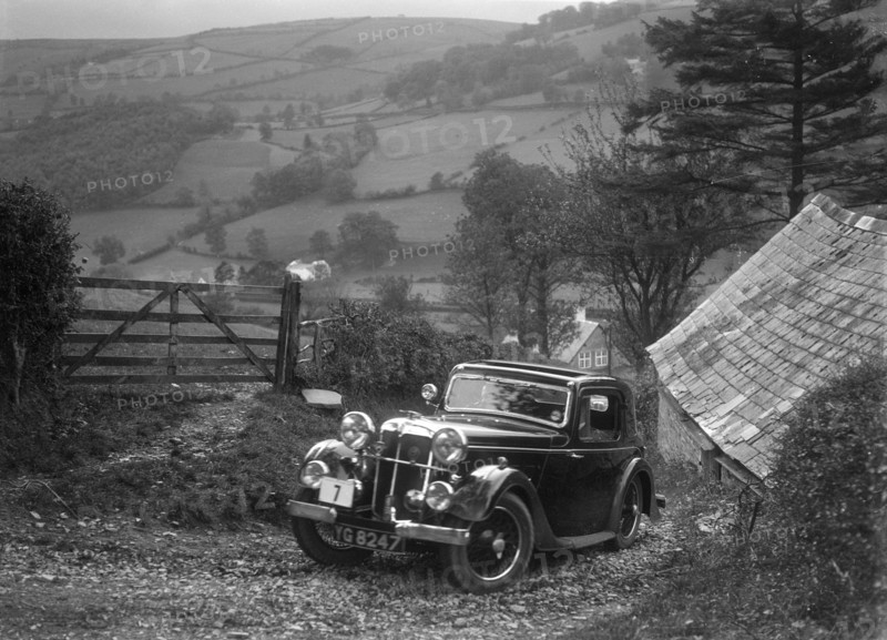 1934 Standard Avon Ten coupe taking part in a Standard Car Owners Club trial. Artist: Bill Brunell.