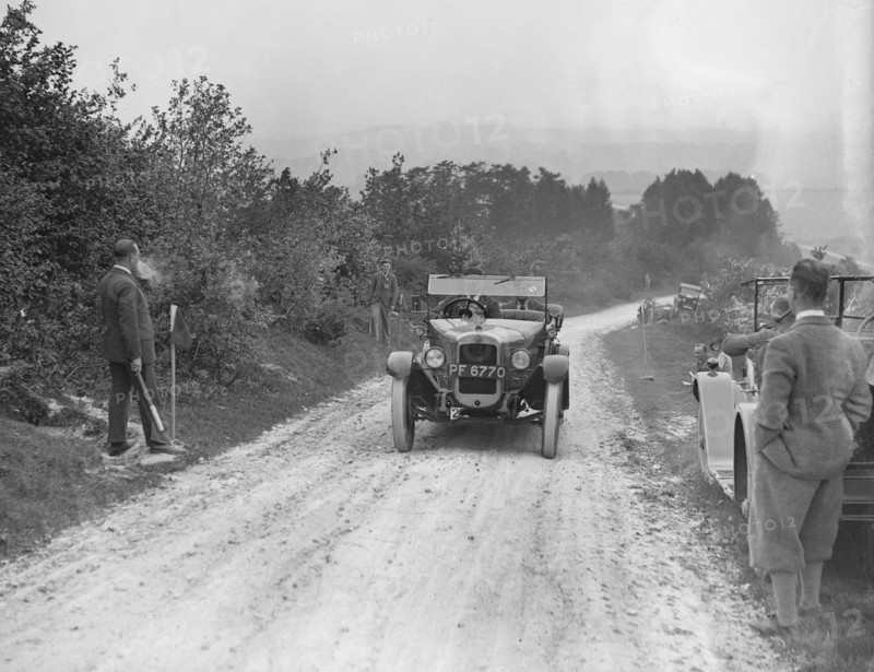 Austin 12/4 open 4-seater taking part in the North West London Motor Club Trial, 1 June 1929. Artist: Bill Brunell.