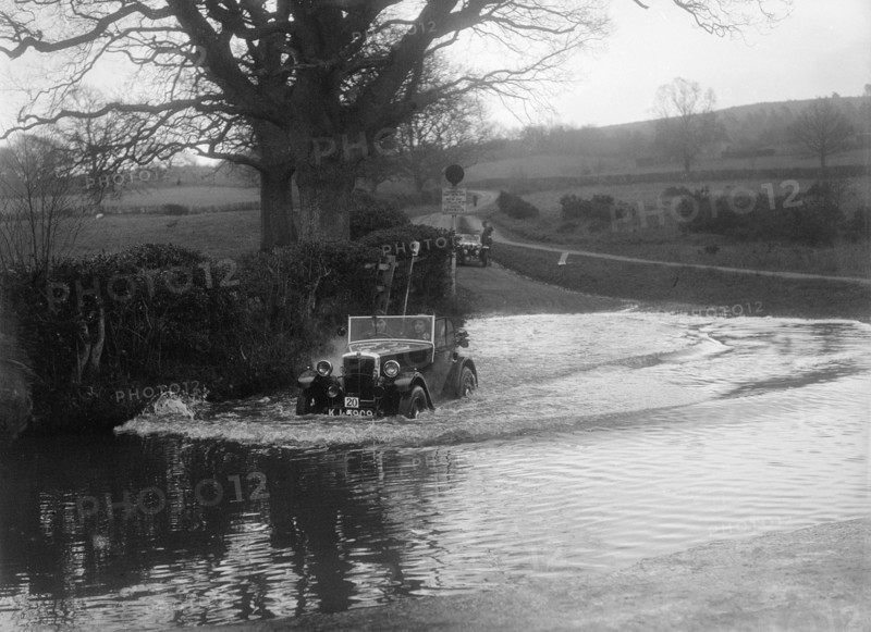1932 Morris Minor tourer driving through a ford during a motoring trial, 1936. Artist: Bill Brunell.
