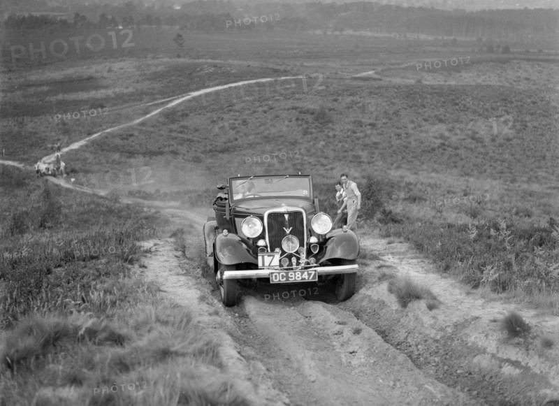 1934 Ford V8 open 2-seater taking part in the NWLMC Lawrence Cup Trial, 1937. Artist: Bill Brunell.