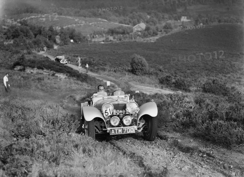 1936 Jaguar SS100 taking part in the NWLMC Lawrence Cup Trial, 1937. Artist: Bill Brunell.