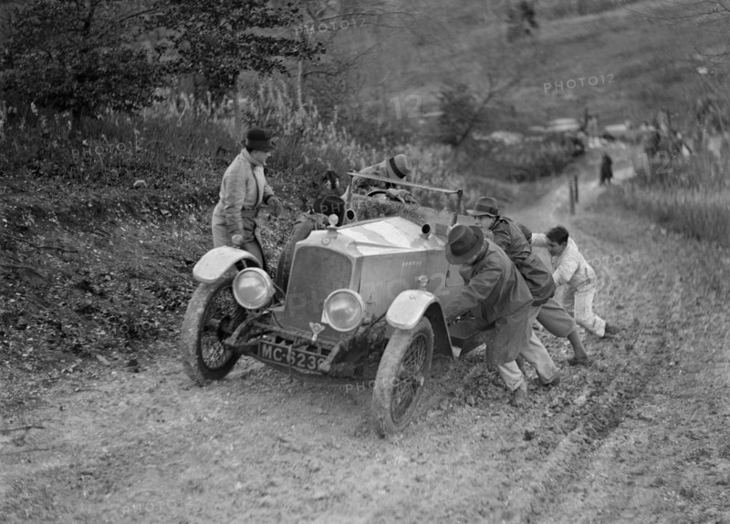 EA Beale's Vauxhall 30-98 Velox 4 seater receiving a push during the Inter-Varsity Trial, 1930. Artist: Bill Brunell.