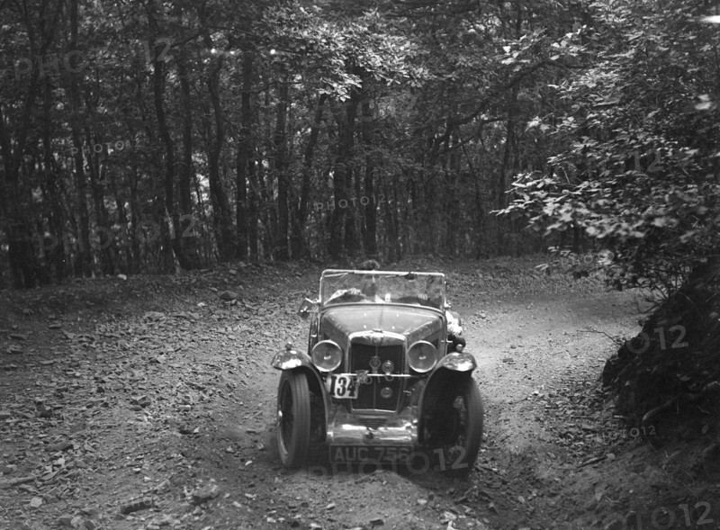 MG J2 competing in the B&HMC Brighton-Beer Trial, Fingle Bridge Hill, Devon, 1934. Artist: Bill Brunell.