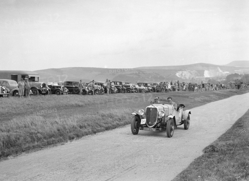 Ford V8 open tourer of GJC Matthews competing at the Lewes Speed Trials, Sussex, 1938. Artist: Bill Brunell.