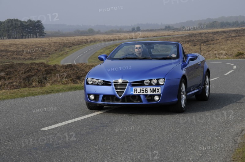 2006 Alfa Romeo Spyder driving in New Forest. Artist: Unknown.