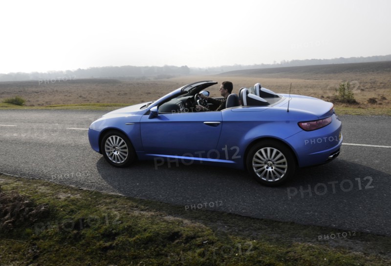 2006 Alfa Romeo Spyder driving in New Forest. Artist: Unknown.