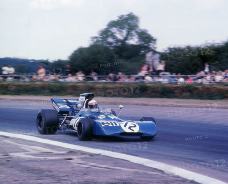 Tyrrell 003 driven by Jackie Stewart in 1971 British GP. Artist: Unknown.