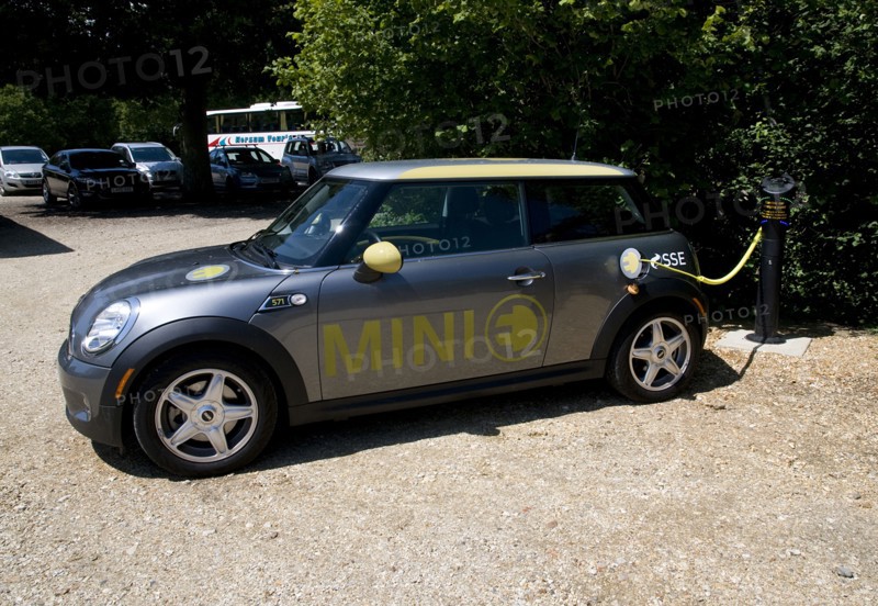 Electric Mini at battery charging point 2011 Artist: Unknown.