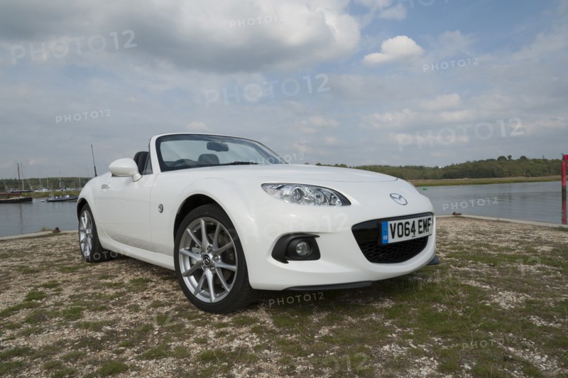 2014 Mazda MX5 Roadster Coupe Artist: Unknown.
