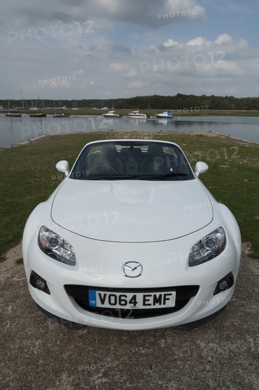 2014 Mazda MX5 Roadster Coupe Artist: Unknown.