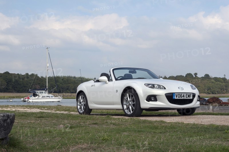 2014 Mazda MX5 Roadster Coupe Artist: Unknown.
