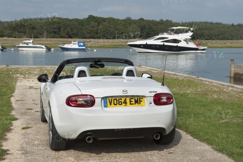 2014 Mazda MX5 Roadster Coupe Artist: Unknown.