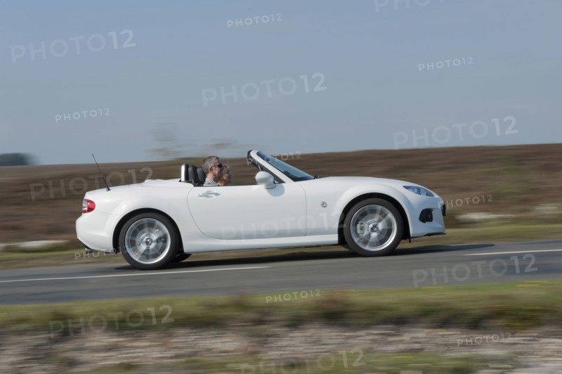 2014 Mazda MX5 Roadster Coupe Artist: Unknown.