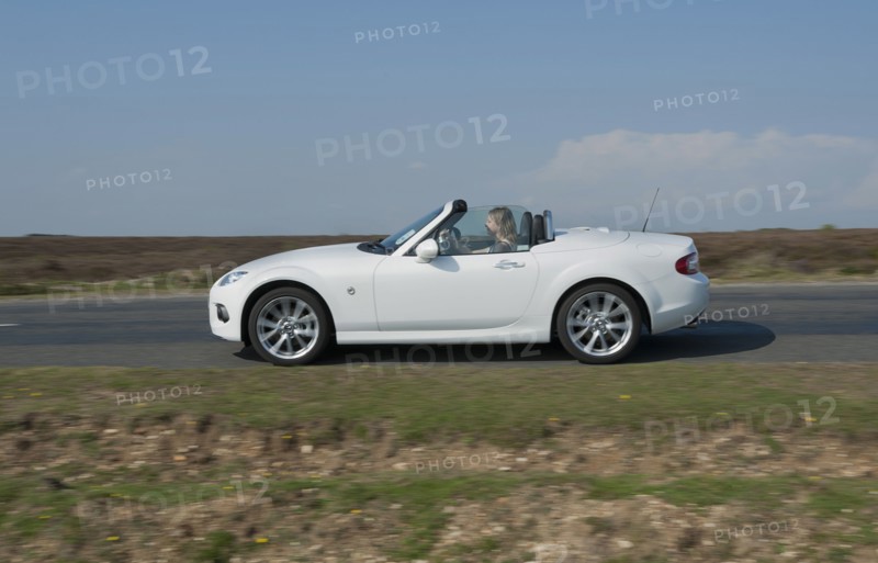 2014 Mazda MX5 Roadster Coupe Artist: Unknown.