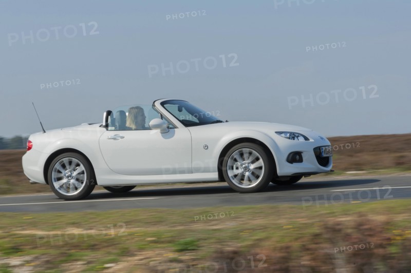 2014 Mazda MX5 Roadster Coupe Artist: Unknown.