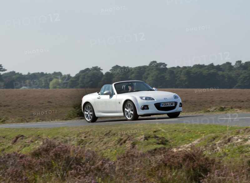 2014 Mazda MX5 Roadster Coupe Artist: Unknown.