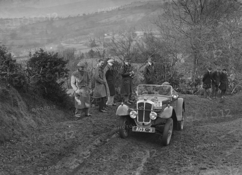 Austin 7 Grasshopper of TH Cole competing in the MG Car Club Midland Centre Trial, 1938. Artist: Bill Brunell.