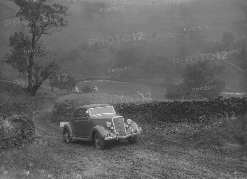 Ford V8 2-seater and dickey of IDK Stewart competing in the MCC Sporting Trial, 1935. Artist: Bill Brunell.