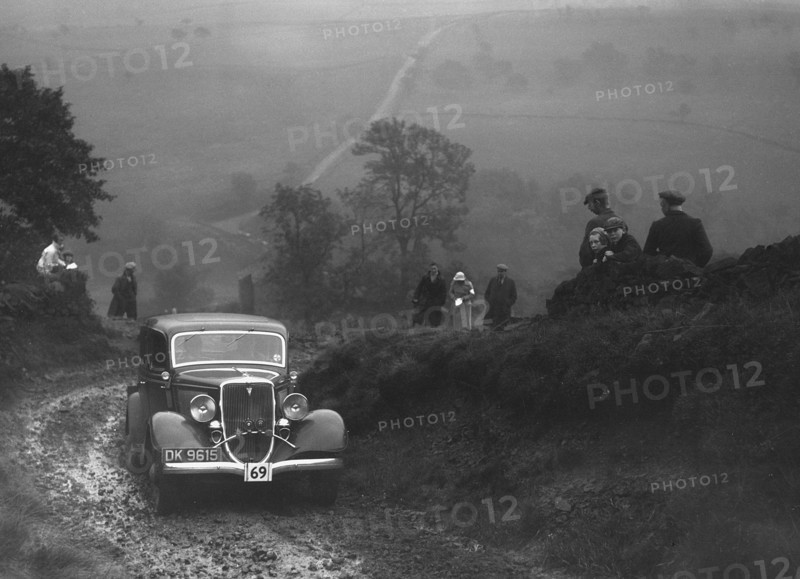 Ford V8 saloon of WT Platt competing in the MCC Sporting Trial, 1935. Artist: Bill Brunell.