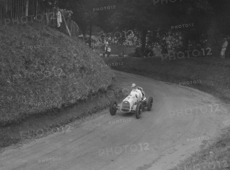 Austin 7 of LP Driscoll competing in the MAC Shelsley Walsh Speed Hill Climb, Worcestershire, 1935. Artist: Bill Brunell.