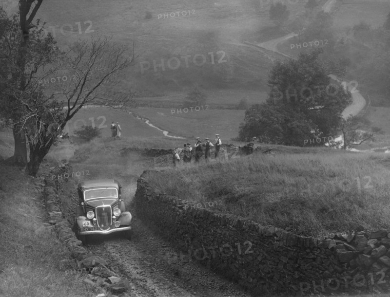 Ford V8 saloon of F Allott competing in the MCC Sporting Trial, 1935. Artist: Bill Brunell.