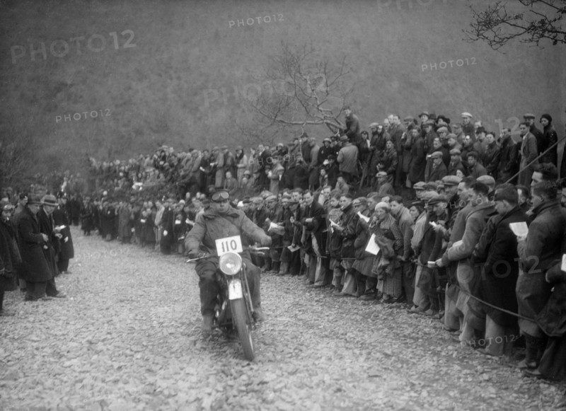 347 cc AJS of J Hey competing in the MCC Lands End Trial, Beggars Roost, Devon, 1936. Artist: Bill Brunell.