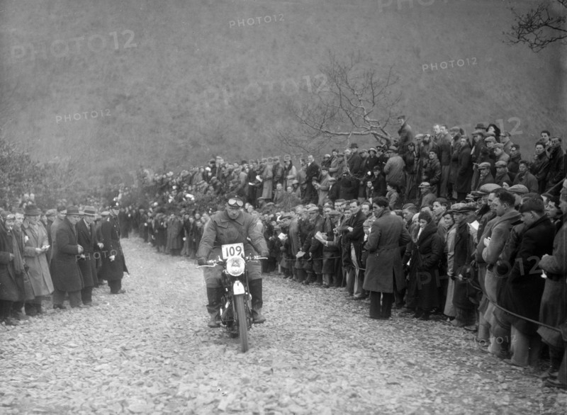347 cc AJS of RW Cassam competing in the MCC Lands End Trial, Beggars Roost, Devon, 1936. Artist: Bill Brunell.