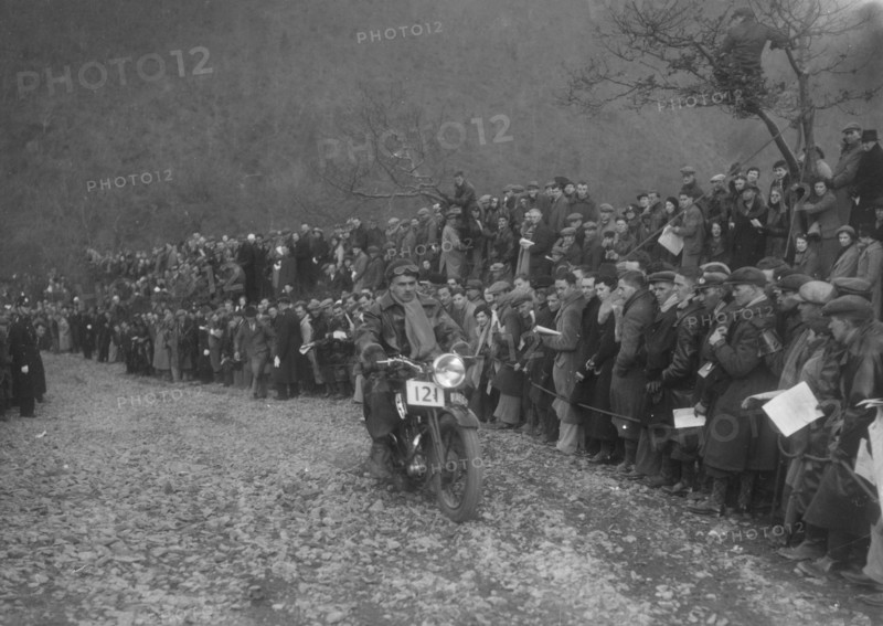 250 cc Triumph of J Stagg competing in the MCC Lands End Trial, Beggars Roost, Devon, 1936. Artist: Bill Brunell.