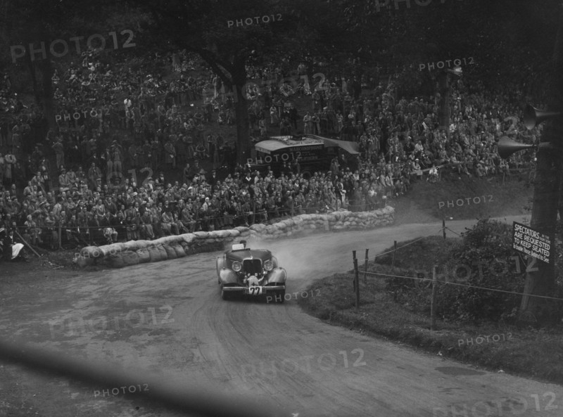 Unidentified car with supercharger competing in the Shelsley Walsh Hillclimb, Worcestershire, 1935. Artist: Bill Brunell.