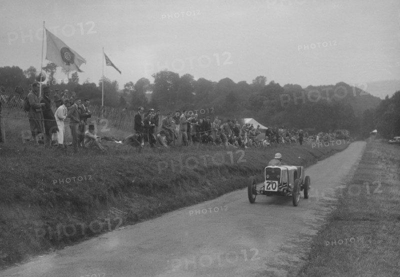 Singer competing in the Shelsley Walsh Hillclimb, Worcestershire, 1935. Artist: Bill Brunell.