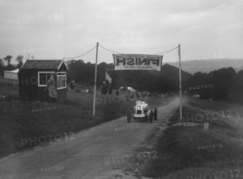 Unidentified offset single-seater car finishing the Shelsley Walsh Hillclimb, Worcestershire, 1935. Artist: Bill Brunell.