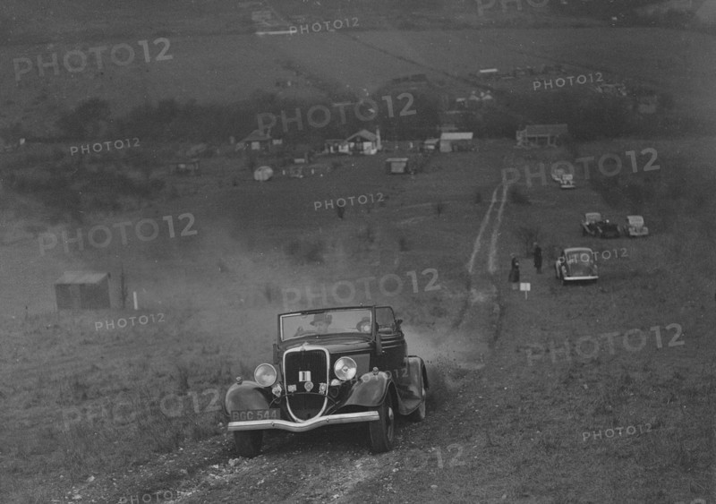Ford V8 competing in the London Motor Club Coventry Cup Trial, Knatts Hill, Kent, 1938. Artist: Bill Brunell.