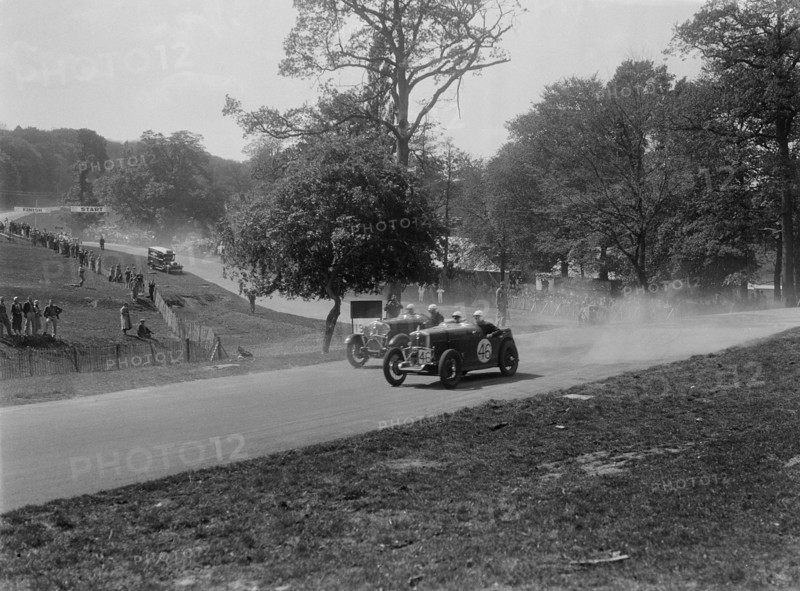 Two Wolseleys racing, Donington Park Race Meeting, Leicestershire, 1933. Artist: Bill Brunell.