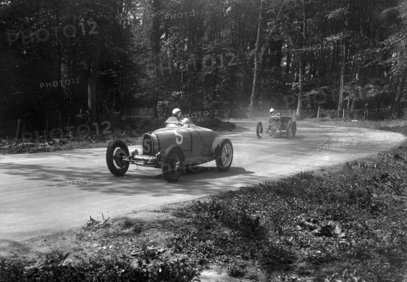 TP Cholmondeley-Tapper's Bugatti Type 37A leading a Frazer-Nash TT replica at Donington Park, 1930s. Artist: Bill Brunell.