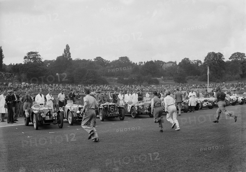 Drivers running to their cars at the start of a race at Crystal Palace, London, 1939. Artist: Bill Brunell.
