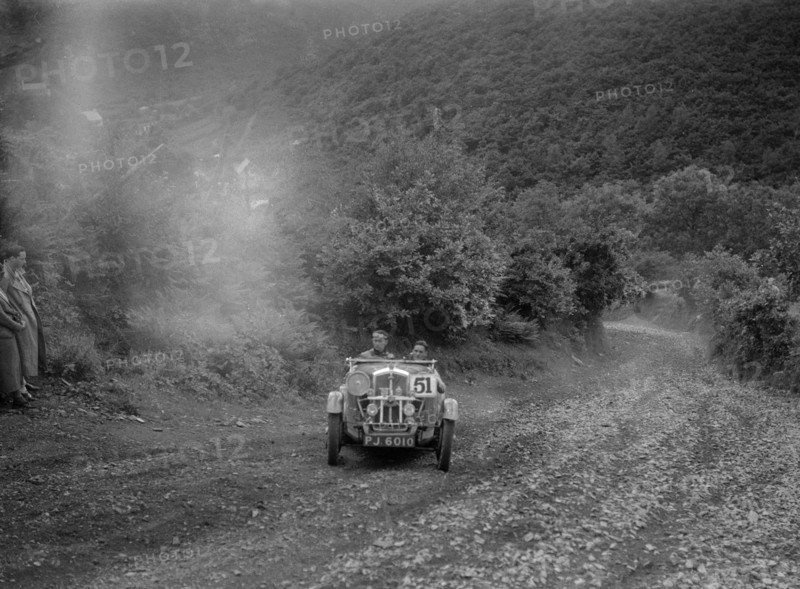 Wolseley Hornet competing in the Mid Surrey AC Barnstaple Trial, Beggars Roost, Devon, 1934. Artist: Bill Brunell.