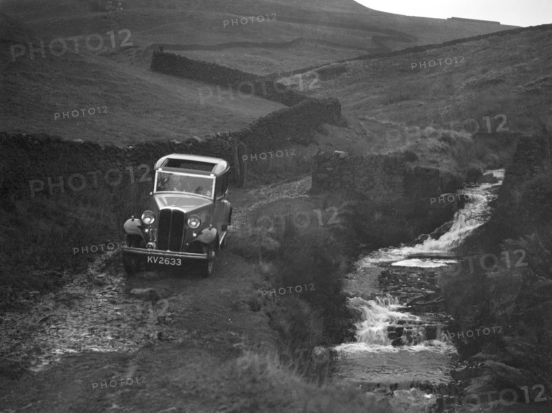 Kitty Brunell road testing a Standard Little Twelve saloon, c1932. Artist: Bill Brunell.