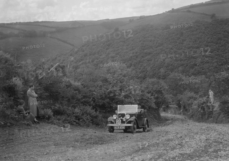 Austin 10 competing in the Mid Surrey AC Barnstaple Trial, Beggars Roost, Devon, 1934. Artist: Bill Brunell.