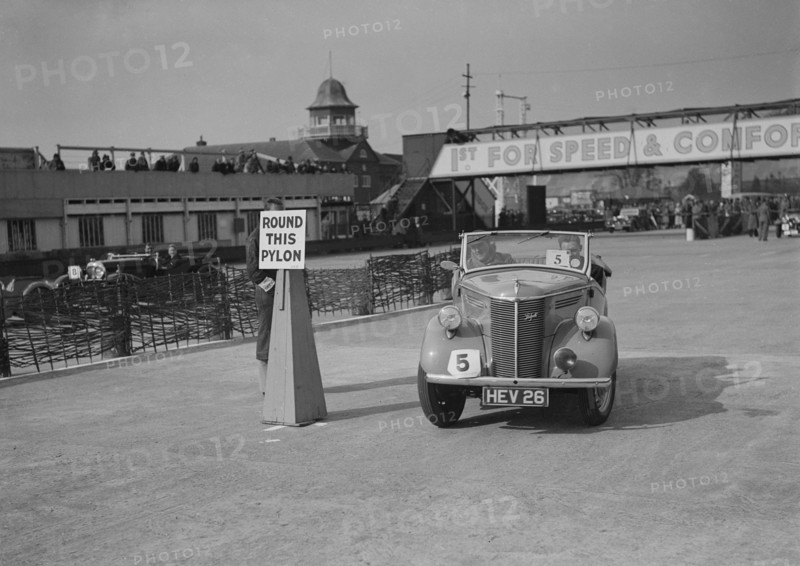 Ford Prefect tourer competing in the JCC Rally, Brooklands, Surrey, 1939. Artist: Bill Brunell.